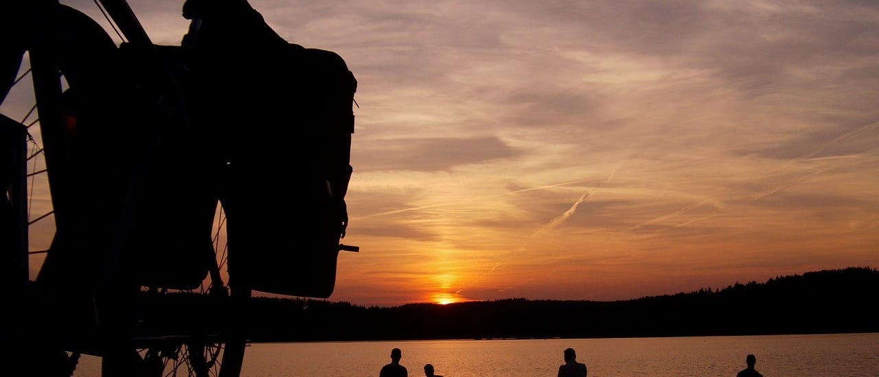 Back pack hanging with sunset back ground