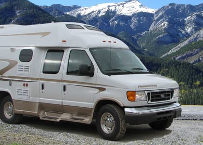 Camper van parked near mountains