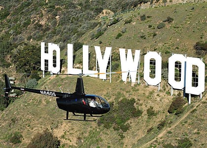 Helicopter flying near Hollywood sign