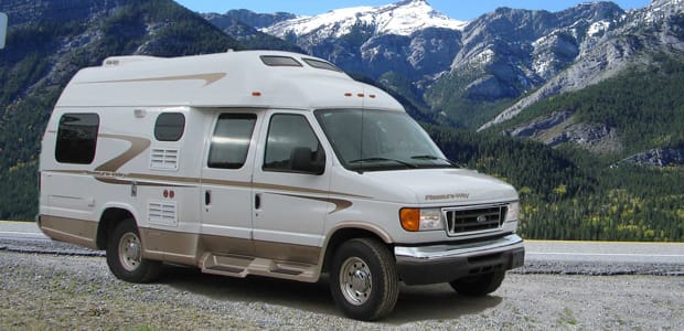 Camper van parked near mountains