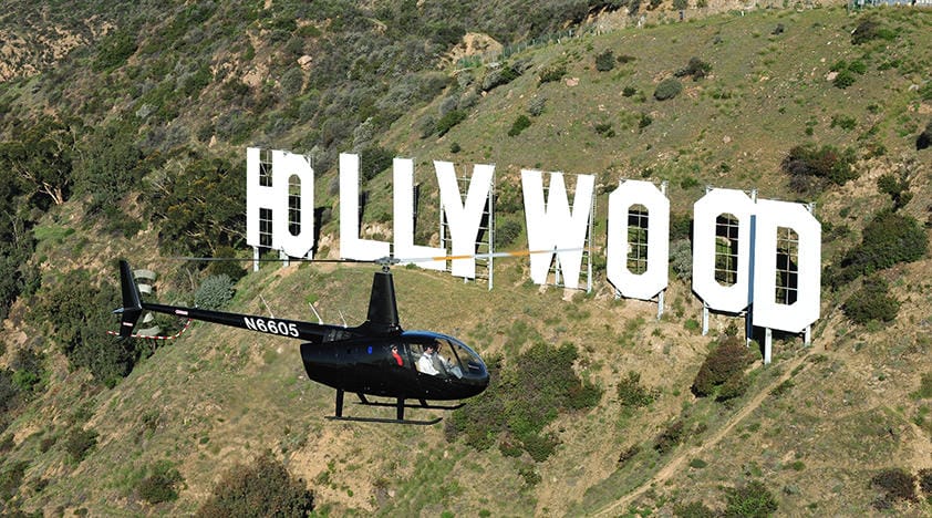 Helicopter flying near Hollywood sign